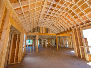 Interior view of a home under construction showcasing innovative framing solutions for spacious living areas.