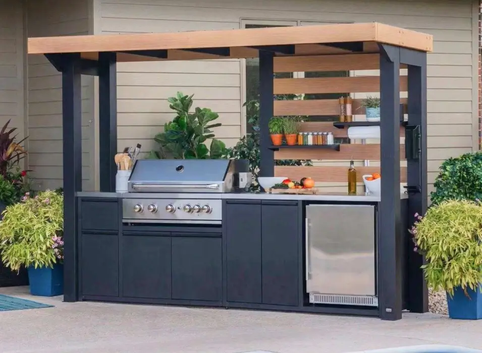 two queens home services outdoor kitchen featuring a grill and sink